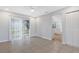 Bright dining area with tile floors and view into kitchen at 6415 Coliseum Blvd, Port Charlotte, FL 33981
