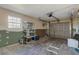 Unfinished garage with storage shelves and an overhead door at 6415 Coliseum Blvd, Port Charlotte, FL 33981