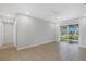 Clean hallway with light grey walls and tile floors at 6415 Coliseum Blvd, Port Charlotte, FL 33981