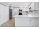 Modern kitchen with white cabinets and stainless steel appliances at 6415 Coliseum Blvd, Port Charlotte, FL 33981