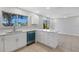 Modern kitchen with white cabinets and stainless steel appliances at 6415 Coliseum Blvd, Port Charlotte, FL 33981