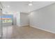 Open living room with tile floor and neutral walls at 6415 Coliseum Blvd, Port Charlotte, FL 33981