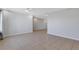 Spacious living area featuring tile flooring and a neutral color palette at 6415 Coliseum Blvd, Port Charlotte, FL 33981