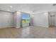 Bright living room with tile floors, a ceiling fan, and neutral wall colors at 6415 Coliseum Blvd, Port Charlotte, FL 33981