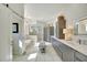 Modern bathroom with soaking tub, walk-in shower, and dual sinks at 7003 River Club Blvd, Bradenton, FL 34202