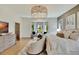 Main bedroom with hardwood floors and brick accent wall at 7003 River Club Blvd, Bradenton, FL 34202