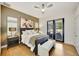 Bedroom with light wood floors, a comfy bed, and access to the backyard at 7003 River Club Blvd, Bradenton, FL 34202