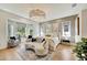 Bright bedroom with hardwood floors and large windows at 7003 River Club Blvd, Bradenton, FL 34202
