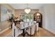 Elegant dining room features a brick accent wall, large windows, and a dark wood dining table at 7003 River Club Blvd, Bradenton, FL 34202