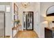 Bright entryway with hardwood floors and a modern console table at 7003 River Club Blvd, Bradenton, FL 34202