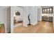Light and airy hallway with hardwood floors and access to home office at 7003 River Club Blvd, Bradenton, FL 34202