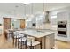 Modern kitchen with double islands, stainless steel appliances, and white shaker cabinets at 7003 River Club Blvd, Bradenton, FL 34202