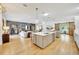 Open concept kitchen with double islands, stainless steel appliances, and hardwood floors at 7003 River Club Blvd, Bradenton, FL 34202
