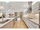 Modern kitchen with a long island, stainless steel appliances, and hardwood floors at 7003 River Club Blvd, Bradenton, FL 34202