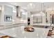 Modern kitchen with large island, white cabinets, and stainless steel appliances at 7003 River Club Blvd, Bradenton, FL 34202