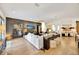 Spacious living room with sectional sofa, hardwood floors, and large TV at 7003 River Club Blvd, Bradenton, FL 34202
