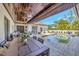 Relaxing poolside patio with covered dining area and comfortable seating at 7003 River Club Blvd, Bradenton, FL 34202