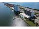 Aerial view showing waterfront building, pool, and dock at 7100 Sunshine Skyway S Ln # 706, St Petersburg, FL 33711