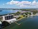 Aerial view of building, pool, dock and tennis courts at 7100 Sunshine Skyway S Ln # 706, St Petersburg, FL 33711