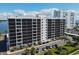 Aerial view of condo building with parking and landscaping at 7100 Sunshine Skyway S Ln # 706, St Petersburg, FL 33711