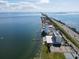 Aerial view of waterfront property with tennis courts at 7100 Sunshine Skyway S Ln # 706, St Petersburg, FL 33711