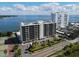 Aerial view of waterfront condo building with tennis courts and parking at 7100 Sunshine Skyway S Ln # 706, St Petersburg, FL 33711
