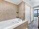 Spa-like bathroom with a large bathtub and double closets at 7100 Sunshine Skyway S Ln # 706, St Petersburg, FL 33711