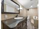 Bathroom with granite countertop, large mirror, and a built-in bathtub at 7100 Sunshine Skyway S Ln # 706, St Petersburg, FL 33711