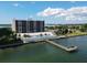 Building, pool and dock with water access at 7100 Sunshine Skyway S Ln # 706, St Petersburg, FL 33711