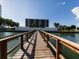 Long wooden dock leading to waterfront property at 7100 Sunshine Skyway S Ln # 706, St Petersburg, FL 33711