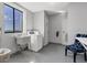 Well-lit laundry room with washer, dryer, and sink at 7100 Sunshine Skyway S Ln # 706, St Petersburg, FL 33711