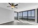 Bright living room with water views and hardwood floors at 7100 Sunshine Skyway S Ln # 706, St Petersburg, FL 33711
