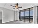 Living room featuring hardwood floors and access to balcony with scenic view at 7100 Sunshine Skyway S Ln # 706, St Petersburg, FL 33711