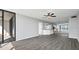 Spacious living room with hardwood floors and access to balcony at 7100 Sunshine Skyway S Ln # 706, St Petersburg, FL 33711