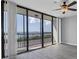 Bright living room with water view and sliding glass doors leading to a balcony at 7100 Sunshine Skyway S Ln # 706, St Petersburg, FL 33711