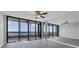 Spacious living room with a full wall mirror and stunning water views at 7100 Sunshine Skyway S Ln # 706, St Petersburg, FL 33711