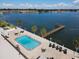 Community pool and pier with waterfront views at 7100 Sunshine Skyway S Ln # 706, St Petersburg, FL 33711