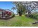Landscaped backyard with mature trees and privacy at 7153 Drewrys Blf, Bradenton, FL 34203