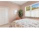 Serene bedroom with a floral bedspread and ample closet space at 7153 Drewrys Blf, Bradenton, FL 34203