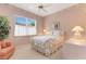 Cozy bedroom with a floral bedspread and ceiling fan at 7153 Drewrys Blf, Bradenton, FL 34203
