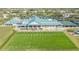 Aerial view of clubhouse with tennis courts and driving range at 7153 Drewrys Blf, Bradenton, FL 34203