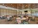 Clubhouse dining area with numerous tables and chairs at 7153 Drewrys Blf, Bradenton, FL 34203