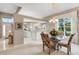 Open concept dining room with view into kitchen and living areas at 7153 Drewrys Blf, Bradenton, FL 34203