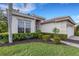House exterior showcasing a large window and landscaping at 7153 Drewrys Blf, Bradenton, FL 34203