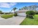 One-story house with a circular driveway and a large front yard at 7153 Drewrys Blf, Bradenton, FL 34203
