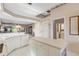 Open kitchen with island and white cabinetry, overlooking dining and living areas at 7153 Drewrys Blf, Bradenton, FL 34203