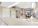 Modern kitchen boasting white cabinets, an island, and ample counter space at 7153 Drewrys Blf, Bradenton, FL 34203
