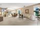Bright and airy living room with curved sofa and open floor plan at 7153 Drewrys Blf, Bradenton, FL 34203