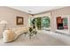 Spacious living room with curved sofa and view of lanai at 7153 Drewrys Blf, Bradenton, FL 34203