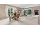 Spacious living area with dining table and access to lanai at 7153 Drewrys Blf, Bradenton, FL 34203